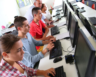 Group of young people in computing class