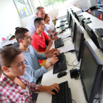 Group of young people in computing class